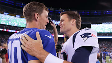 New York Giants quarterback Eli Manning shakes hands with New England Patriots quarterback Tom Brady after their game