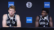 Sep 23, 2025; Brooklyn, NY, USA;  Brooklyn Nets forward Danny Wolf (2) and guard Drake Powell (4) speak at Media Day. Mandatory Credit: Wendell Cruz-Imagn Images