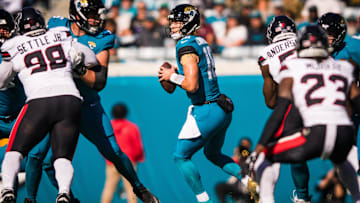 Dec 1, 2024; Jacksonville, Florida, USA; Jacksonville Jaguars quarterback Trevor Lawrence (16) drops back to pass against the Houston Texans in the first quarter at EverBank Stadium. Mandatory Credit: Jeremy Reper-Imagn Images