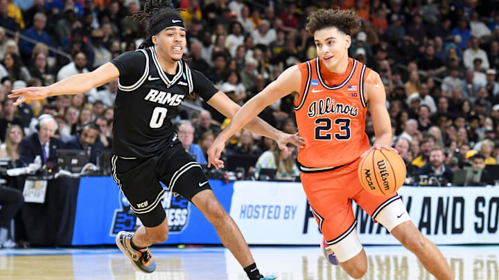 VCU Rams guard Brandon Jennings (0) defends Illinois Fighting Illini guard Keaton Wagler (23) Saturday, March 21, 2026, during the NCAA Men’s Basketball Tournament second round game at Bon Secours Wellness Arena in Greenville, South Carolina.