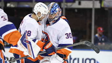 Nov 8, 2025; New York, New York, USA;  New York Islanders goaltender Ilya Sorokin (30) celebrates with defenseman Alexander Romanov (28) after defeating the New York Rangers 5-0 at Madison Square Garden. Mandatory Credit: Wendell Cruz-Imagn Images
