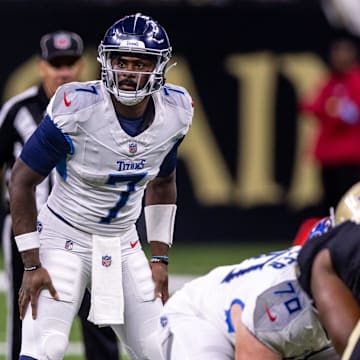 Aug 25, 2024; New Orleans, Louisiana, USA;  Tennessee Titans quarterback Malik Willis (7) looks over the New Orleans Saints defense during the second half at Caesars Superdome. Mandatory Credit: Stephen Lew-Imagn Images