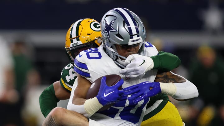 Jan 14, 2024; Arlington, Texas, USA; Dallas Cowboys running back Tony Pollard (20) rushes the ball against the Green Bay Packers during the first half for the 2024 NFC wild card game at AT&T Stadium. Mandatory Credit: Tim Heitman-USA TODAY Sports