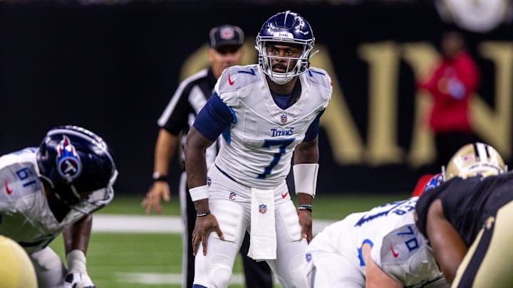 Aug 25, 2024; New Orleans, Louisiana, USA;  Tennessee Titans quarterback Malik Willis (7) looks over the New Orleans Saints defense during the second half at Caesars Superdome. Mandatory Credit: Stephen Lew-Imagn Images