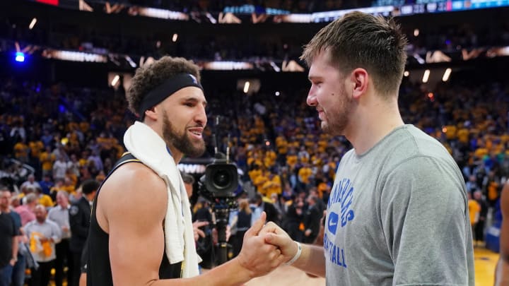 May 26, 2022; San Francisco, California, USA; Dallas Mavericks guard Luka Doncic (77) with Golden State Warriors guard Klay Thompson (11) after game five of the 2022 western conference finals against the Dallas Mavericks at Chase Center. Mandatory Credit: Cary Edmondson-USA TODAY Sports