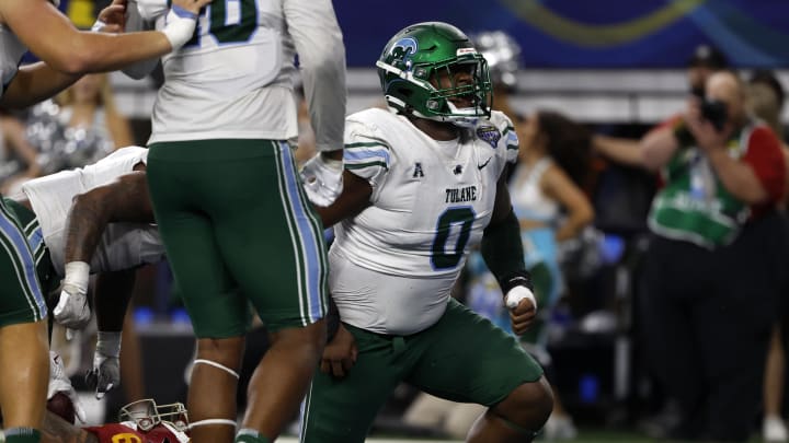 Jan 2, 2023; Arlington, Texas, USA; Tulane Green Wave defensive lineman Patrick Jenkins (0) reacts after tackling USC Trojans running back Austin Jones (6) for a safety in the fourth quarter in the 2023 Cotton Bowl at AT&T Stadium. Mandatory Credit: Tim Heitman-USA TODAY Sports