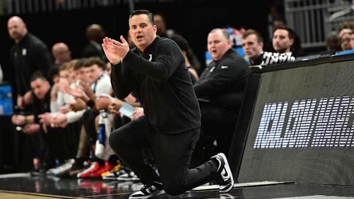 Xavier Musketeers head coach Sean Miller watches play downcourt during the first half