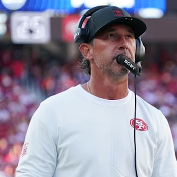 Aug 9, 2025; Santa Clara, California, USA;  San Francisco 49ers head coach Kyle Shanahan watches from the sidelines in the first quarter against the Denver Broncos at Levi's Stadium. Mandatory Credit: David Gonzales-Imagn Images