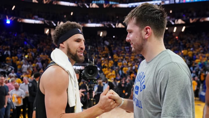 May 26, 2022; San Francisco, California, USA; Dallas Mavericks guard Luka Doncic (77) with Golden State Warriors guard Klay Thompson (11) after game five of the 2022 western conference finals against the Dallas Mavericks at Chase Center. Mandatory Credit: Cary Edmondson-USA TODAY Sports