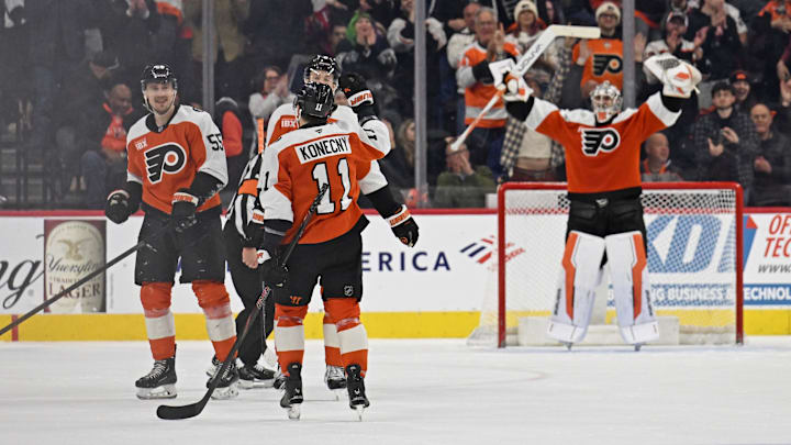 Feb 3, 2026; Philadelphia, Pennsylvania, USA; Philadelphia Flyers defenseman Rasmus Ristolainen (55) celebrates his empty net goal with right wing Travis Konecny (11) against the Washington Capitals during the third period at Xfinity Mobile Arena.
