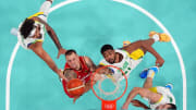 Jul 30, 2024; Villeneuve-d'Ascq, France; Germany power forward Daniel Theis (10) and Brazil power forward Bruno Caboclo (51) go for a rebound in men’s basketball group B play during the Paris 2024 Olympic Summer Games at Stade Pierre-Mauroy. Mandatory Credit: John David Mercer-USA TODAY Sports