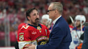 Florida Panthers center Brad Marchand speaks to head coach Paul Maurice after winning the 2025 Stanley Cup Final