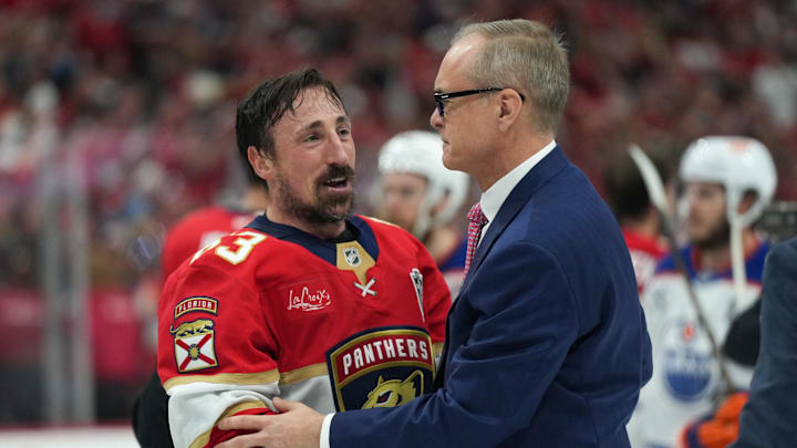 Florida Panthers center Brad Marchand speaks to head coach Paul Maurice after winning the 2025 Stanley Cup Final