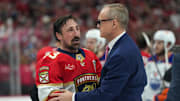 Florida Panthers center Brad Marchand (63) speaks to head coach Paul Maurice after winning game six of the 2025 Stanley Cup Final against the Edmonton Oilers at Amerant Bank Arena.