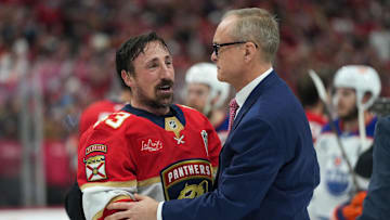 Florida Panthers center Brad Marchand (63) speaks to head coach Paul Maurice after winning game six of the 2025 Stanley Cup Final against the Edmonton Oilers at Amerant Bank Arena.