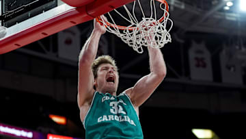 Colin Granger #32 of the Coastal Carolina Chanticleers dunks against the North Carolina State Wolfpack during the game at Lenovo Center on November 13, 2024 in Raleigh, North Carolina.