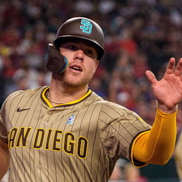 San Diego Padres outfielder Gavin Sheets (30) and infielder Jose Iglesias (7) celebrates after Sheets scores in the fourth inning against the Arizona Diamondbacks at Chase Field on June 15.
