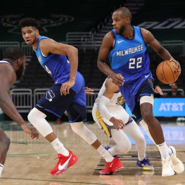 Dec 25, 2020; Milwaukee, WI, USA; Milwaukee Bucks forward Khris Middleton (22) controls the ball against the Golden State Warriors during a NBA game at the Bradley Center. 