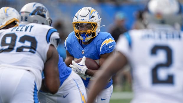 Sep 15, 2024; Charlotte, North Carolina, USA; Los Angeles Chargers running back J.K. Dobbins (27) looks for running room agai