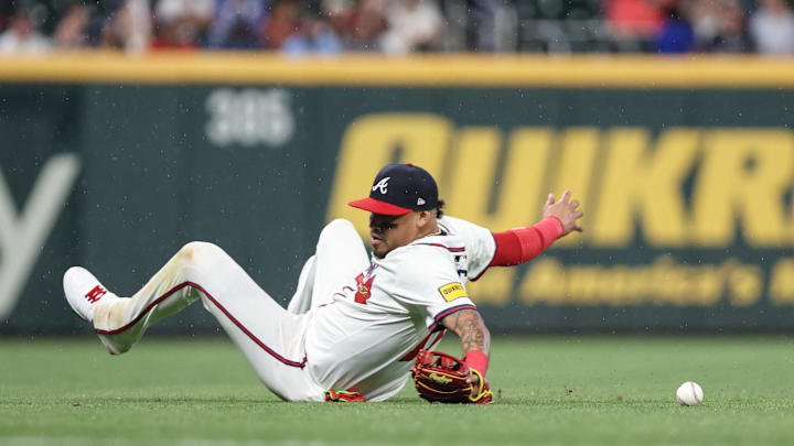 Apr 22, 2025; Cumberland, Georgia, USA; Atlanta Braves shortstop Orlando Arcia (11) makes an error in the field against the St. Louis Cardinals during the eighth inning at Truist Park. Mandatory Credit: Jordan Godfree-Imagn Images