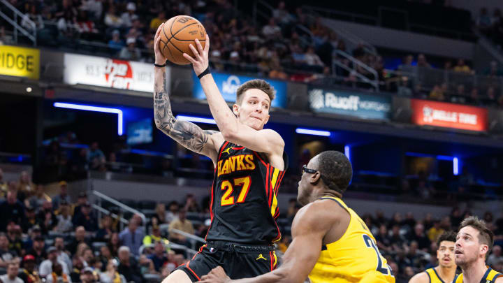 Apr 14, 2024; Indianapolis, Indiana, USA; Atlanta Hawks guard Vit Krejci (27) passes the ball while Atlanta Hawks guard Garrison Mathews (25) defends in the second half at Gainbridge Fieldhouse. Mandatory Credit: Trevor Ruszkowski-USA TODAY Sports