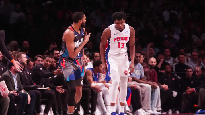 Apr 6, 2024; Brooklyn, New York, USA; Brooklyn Nets small forward Mikal Bridges (1) reacts to making a three-point jump shot against Detroit Pistons center James Wiseman (13) during the first half at Barclays Center. Mandatory Credit: Gregory Fisher-USA TODAY Sports