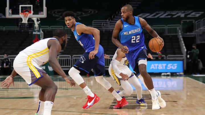 Dec 25, 2020; Milwaukee, WI, USA; Milwaukee Bucks forward Khris Middleton (22) controls the ball against the Golden State Warriors during a NBA game at the Bradley Center. 