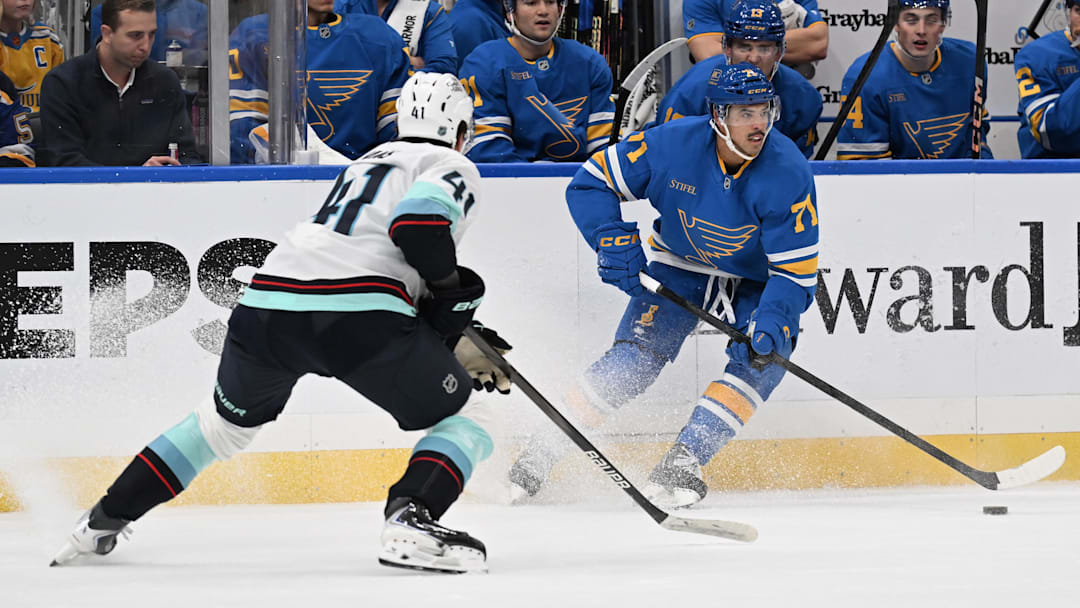 Nov 8, 2025; St. Louis, Missouri, USA; Seattle Kraken defenseman Ryker Evans (41) defends against the St. Louis Blues right wing Mathieu Joseph (71) in the second period at Enterprise Center. Mandatory Credit: Joe Puetz-Imagn Images Nov 8, 2025; St. Louis, Missouri, USA; Seattle Kraken defenseman Ryker Evans (41) defends against the St. Louis Blues right wing Mathieu Joseph (71) in the second period at Enterprise Center. Mandatory Credit: Joe Puetz-Imagn Images