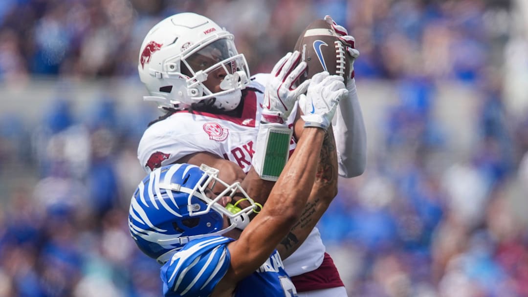 Memphis' Marcello Bussey (6) has the ball pulled out of his hands by Arkansas' Julian Neal (23)