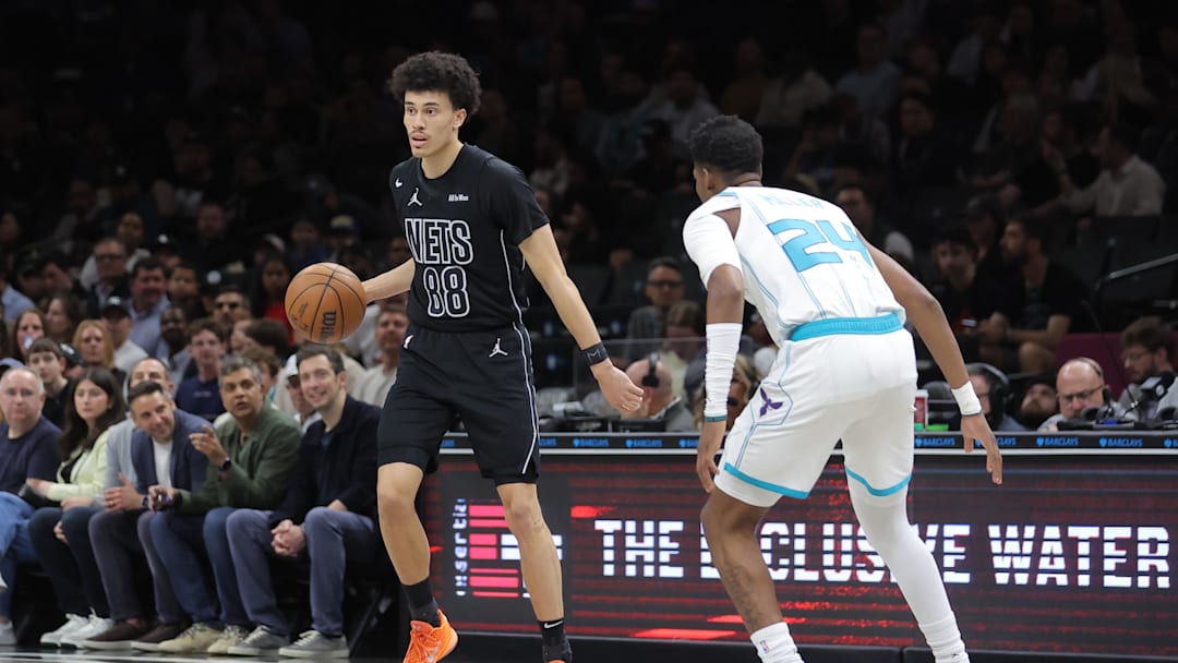Mar 31, 2026; Brooklyn, New York, USA; Brooklyn Nets guard Nolan Traore (88) controls the ball against Charlotte Hornets forward Brandon Miller (24) during the first quarter at Barclays Center. Mandatory Credit: Brad Penner-Imagn Images