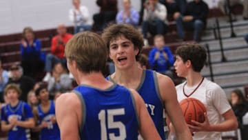 Olentangy Liberty's Tyler Kropp celebrates Parker Van Engelenhoven's basket against Newark during the visiting Patriots' 58-49 victory at Jimmy Allen Gymnasium on Tuesday, Dec. 19, 2023.