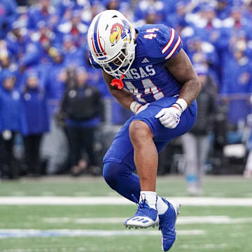 Oct 28, 2023; Lawrence, Kansas, USA; Kansas Jayhawks linebacker Cornell Wheeler (44) celebrates after a play against the Oklahoma Sooners during the second half at David Booth Kansas Memorial Stadium. Mandatory Credit: Denny Medley-Imagn Images