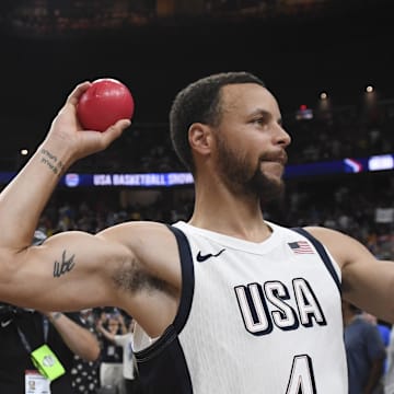 Jul 10, 2024; Las Vegas, Nevada, USA; USA guard Steph Curry (4) throws a ball to the fans after defeating Canada in the USA Basketball Showcase at T-Mobile Arena. Mandatory Credit: Candice Ward-Imagn Images