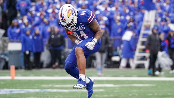 Oct 28, 2023; Lawrence, Kansas, USA; Kansas Jayhawks linebacker Cornell Wheeler (44) celebrates after a play against the Oklahoma Sooners during the second half at David Booth Kansas Memorial Stadium. Mandatory Credit: Denny Medley-Imagn Images