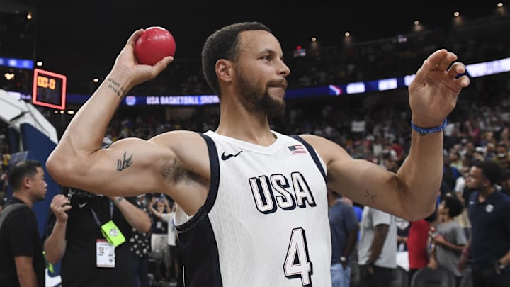 Jul 10, 2024; Las Vegas, Nevada, USA; USA guard Steph Curry (4) throws a ball to the fans after defeating Canada in the USA Basketball Showcase at T-Mobile Arena. 