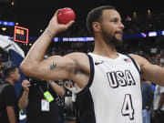 Steph Curry throws a ball to fans after defeating Canada in the USA Basketball Showcase at T-Mobile Arena.