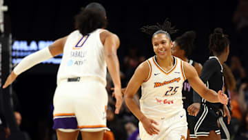 New Mercury forwards Thomas and Sabally celebrate a play against the Golden State Valkyries during a preseason game at PHX Arena. 