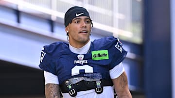 Jul 28, 2025; Foxborough, MA, USA; New England Patriots cornerback Christian Gonzalez (0) heads to the practice fields for training camp at Gillette Stadium. Mandatory Credit: Eric Canha-Imagn Images