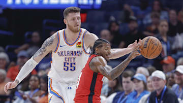 Oct 9, 2024; Oklahoma City, Oklahoma, USA; Oklahoma City Thunder center Isaiah Hartenstein (55) tips the ball away from Houston Rockets guard Jalen Green (4) during the second quarter at Paycom Center. Mandatory Credit: Alonzo Adams-Imagn Images