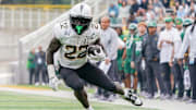 Nov 1, 2025; Waco, Texas, USA; UCF Knights running back Myles Montgomery (22) carries the ball against the Baylor Bears during the second half at McLane Stadium. Mandatory Credit: Raymond Carlin III-Imagn Images
