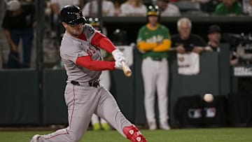 Sep 8, 2025; West Sacramento, California, USA; Boston Red Sox third baseman Alex Bregman (2) hits an rbi single against the Athletics during the fifth inning at Sutter Health Park. Mandatory Credit: Ed Szczepanski-Imagn Images