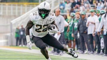 Nov 1, 2025; Waco, Texas, USA; UCF Knights running back Myles Montgomery (22) carries the ball against the Baylor Bears during the second half at McLane Stadium. Mandatory Credit: Raymond Carlin III-Imagn Images