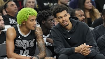 Dec 5, 2024; San Antonio, Texas, USA; Injured San Antonio Spurs center Victor Wembanyama (1) talks with forward Jeremy Sochan (10) during the first half at Frost Bank Center. Mandatory Credit: Scott Wachter-Imagn Images