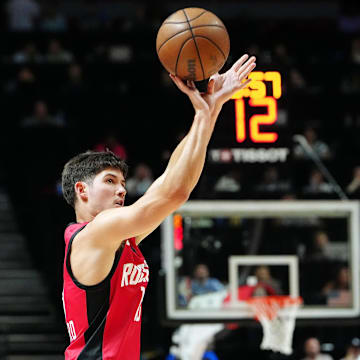 Jul 14, 2024; Las Vegas, NV, USA; Houston Rockets guard Reed Sheppard (15) shoots against the Washington Wizards during the third quarter at Thomas & Mack Center. Mandatory Credit: Stephen R. Sylvanie-Imagn Images