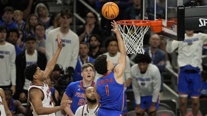 Florida Gators guard Walter Clayton Jr. (1) shoots the ball past Auburn Tigers center Dylan Cardwell (44) during the second half in the semifinals of the men's Final Four of the 2025 NCAA Tournament at Alamodome.  Clayton led Bartow High to state championships in 2020-21.