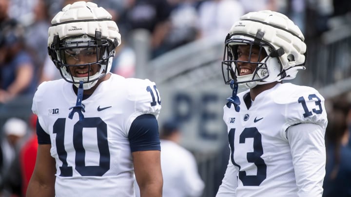 Penn State running backs Nicholas Singleton (10) and Kaytron Allen share a laugh together at Beaver Stadium.