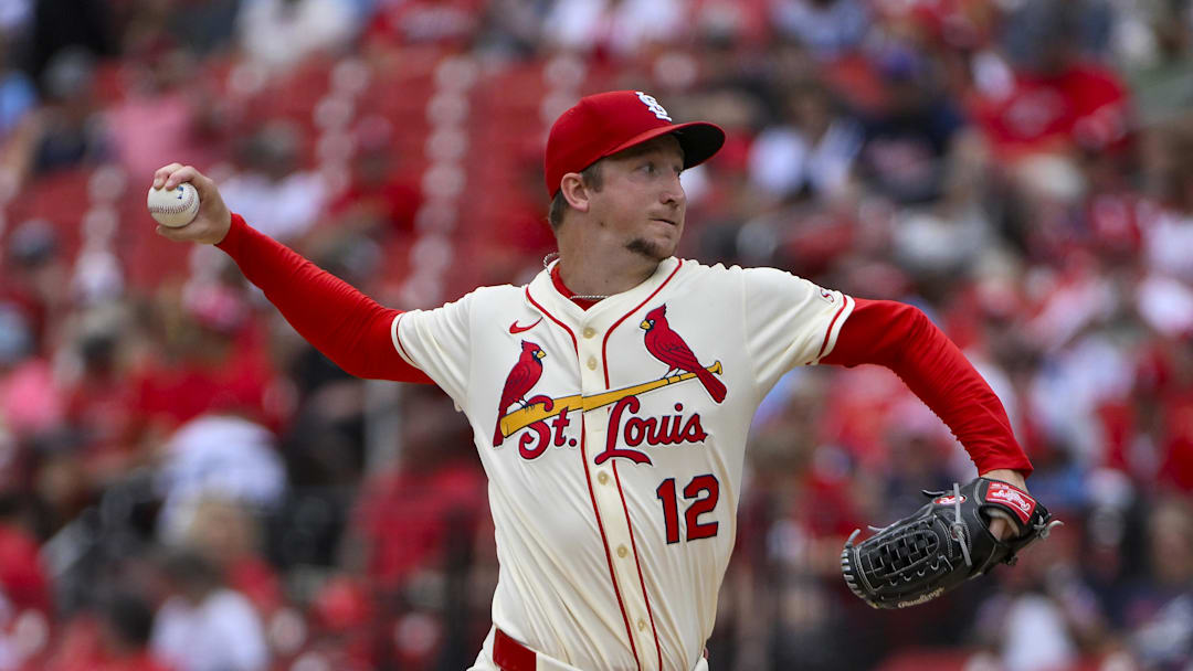 Jul 12, 2025; St. Louis, Missouri, USA;  St. Louis Cardinals starting pitcher Erick Fedde (12) pitches against the Atlanta Braves during the first inning at Busch Stadium. Mandatory Credit: Jeff Curry-Imagn Images