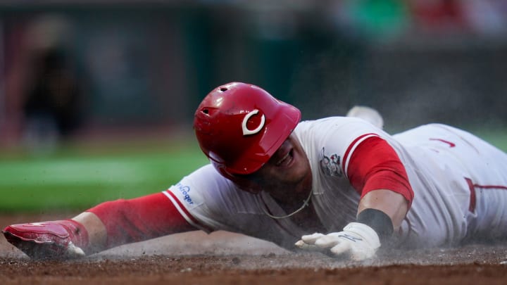 Cincinnati Reds center fielder TJ Friedl (29) slides onto home base during the third inning of the MLB Interleague game between the Cincinnati Reds and the Oakland Athletics, Tuesday, Aug. 27, 2024, at Great American Ball Park in downtown Cincinnati.