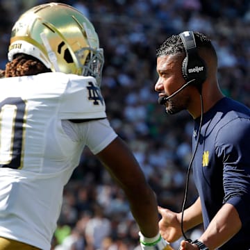 Notre Dame Fighting Irish head coach Marcus Freeman high-fives Notre Dame Fighting Irish wide receiver Kris Mitchell (10) Saturday, Sept. 14, 2024, during the NCAA football game against the Purdue Boilermakers at Ross-Ade Stadium in West Lafayette, Ind.