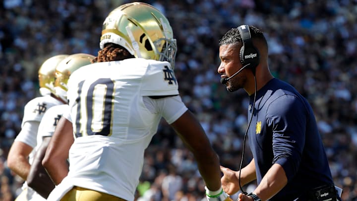 Notre Dame Fighting Irish head coach Marcus Freeman high-fives Notre Dame Fighting Irish wide receiver Kris Mitchell (10) Saturday, Sept. 14, 2024, during the NCAA football game against the Purdue Boilermakers at Ross-Ade Stadium in West Lafayette, Ind.